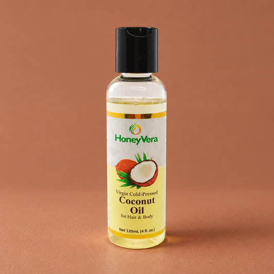 Virgin Cold-Pressed Coconut Hair & Body Oil on a warm brown studio background