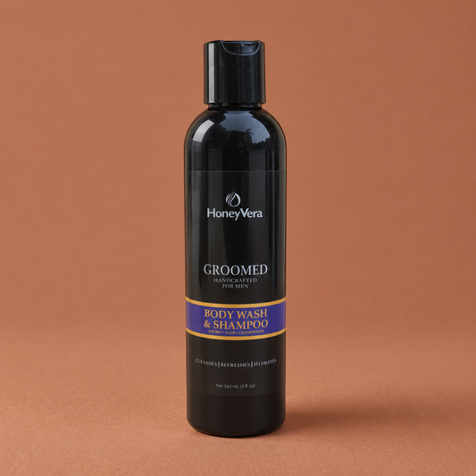GROOMED Body Wash & Shampoo on a warm brown background